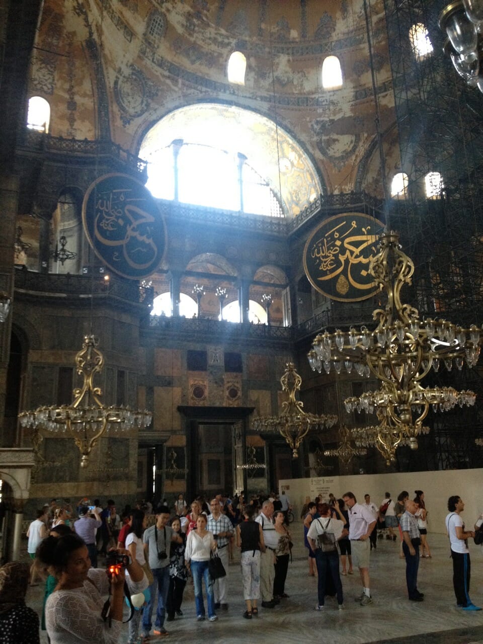 People inside Hagia Sophia and some of its chandeliers, Istanbul.