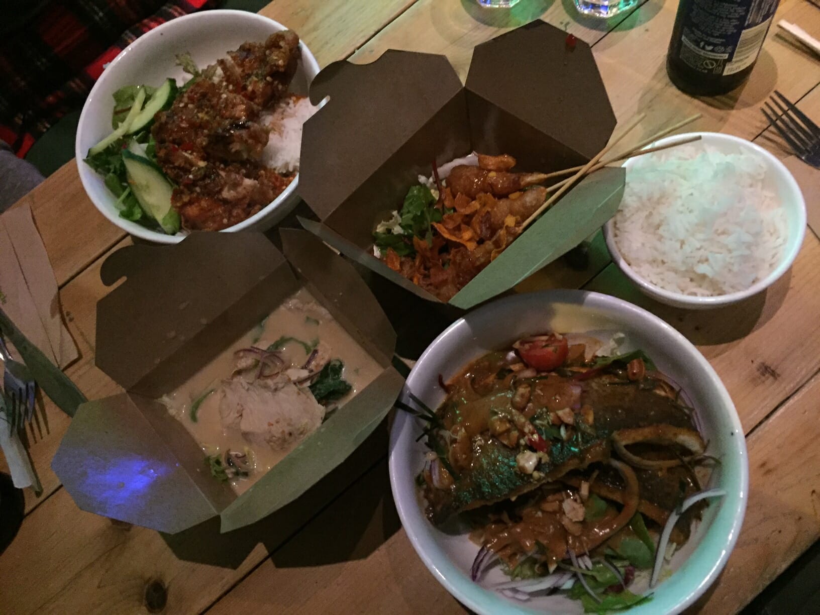 brown paper boxers with Thai food at Ting Thai Caravan Restaurant