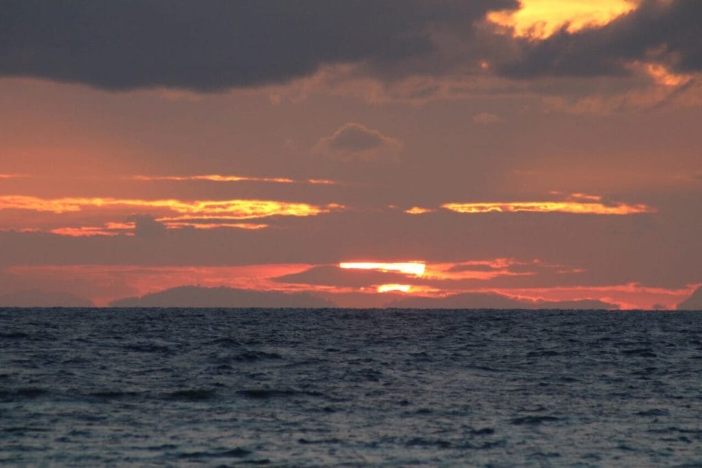 Sunrise at Sunrise Beach, Thailand, and the orange-yellowish sky