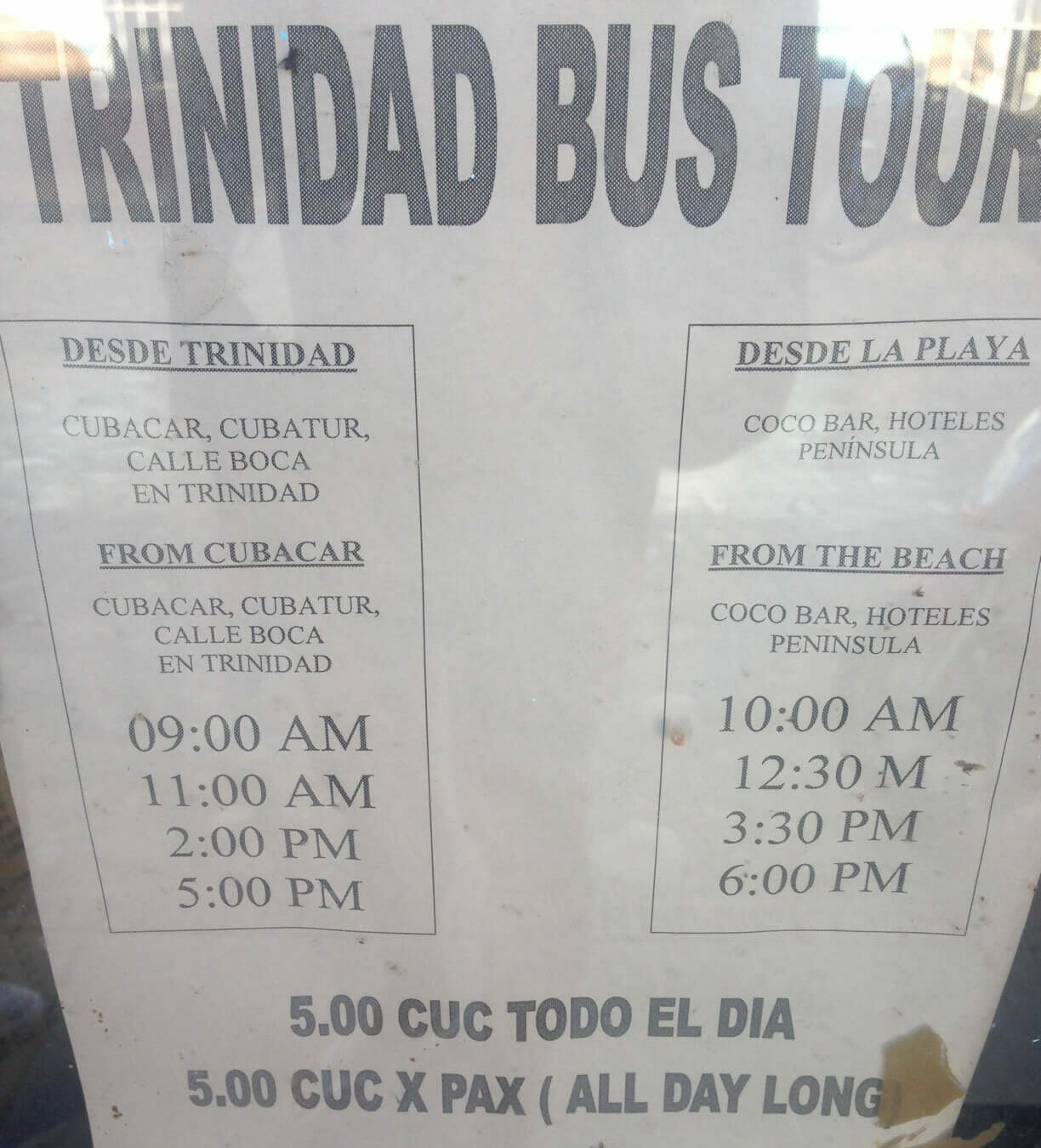 A sign on the bus stop on Calle Lino Pérez, Trinidad, with the timetable and price to Playa Ancon.