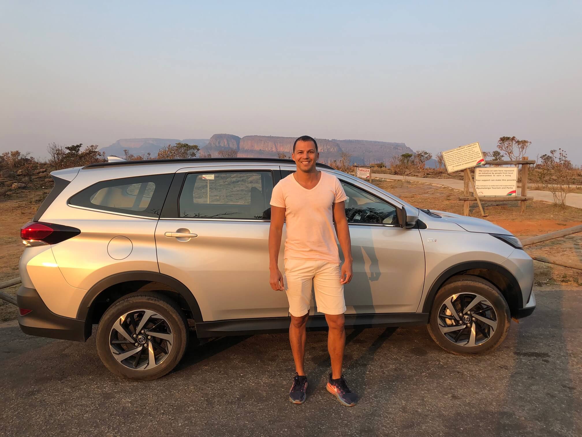 Pericles Rosa and a car behind him at Three Rondavels View Point Souvenir & Parking, South Africa