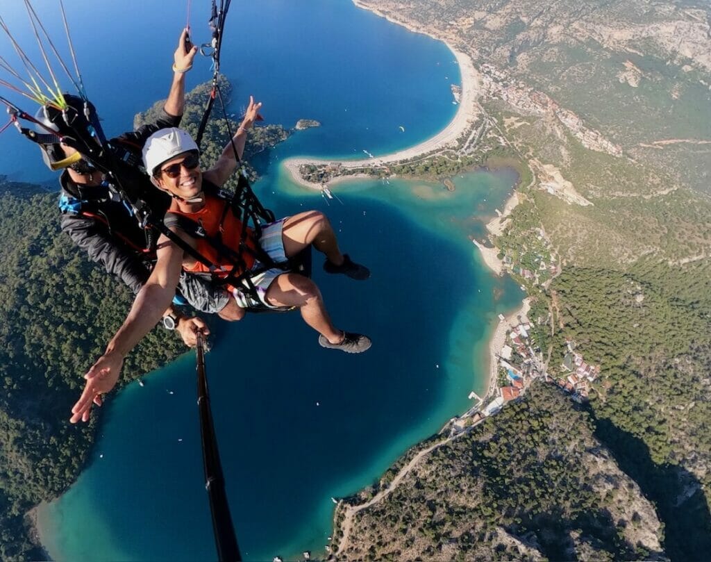 Pericles Rosa flying on a paragliding over the city of Oludeniz, Turkey