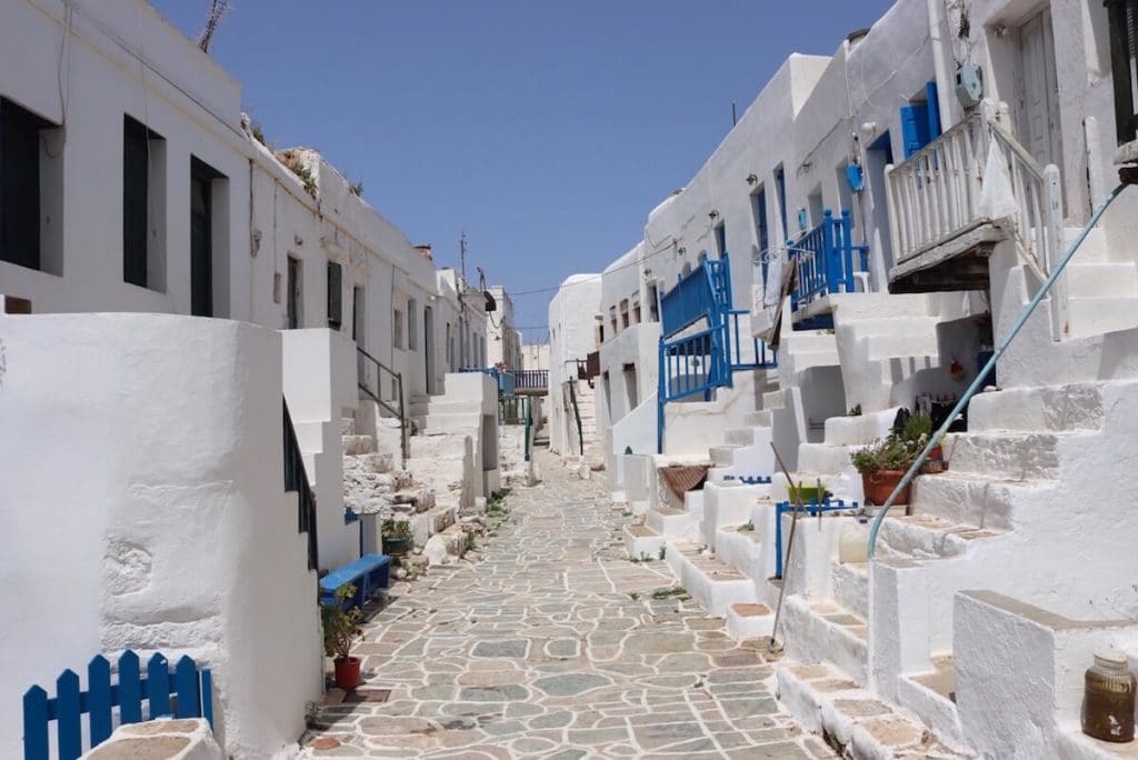 An alleyway surrounded by white-washed house at Chora, Folegandros, Greece