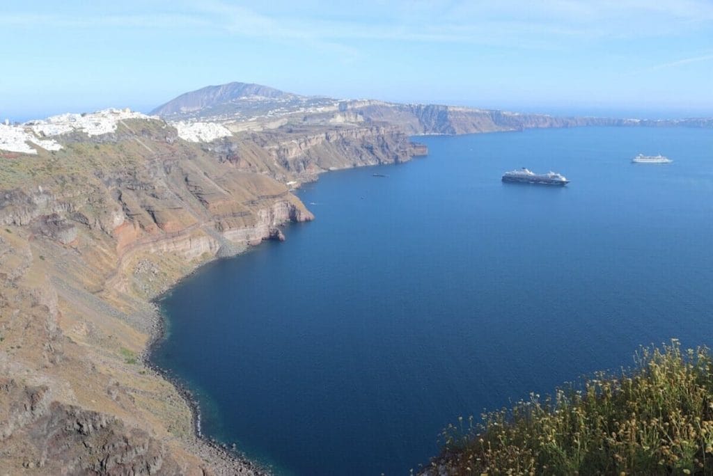 The south part of the main island Thira and the villages of Firostefani and Fira and the Agean Sea. 