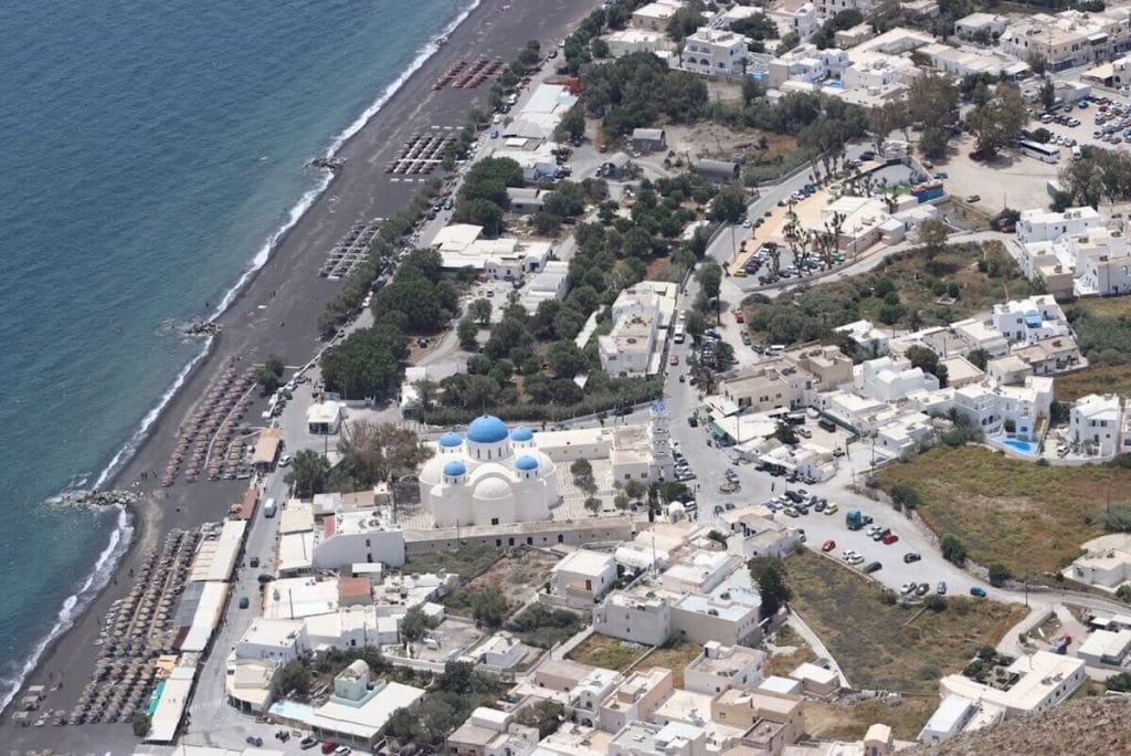 The view of the village of Perissa and its whitewashed houses and the beach from Mesa Vuono Mountain, Santorini