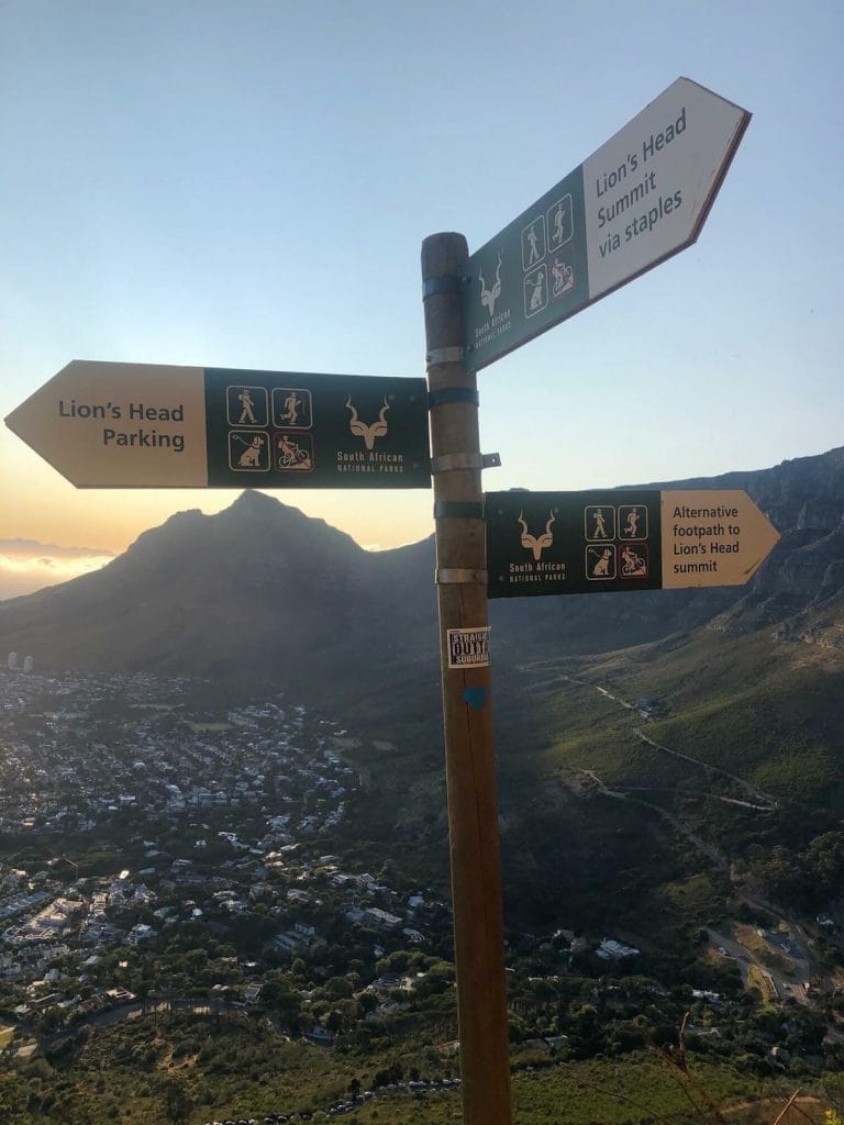 a pole with three sings at Lion's Head Mountain