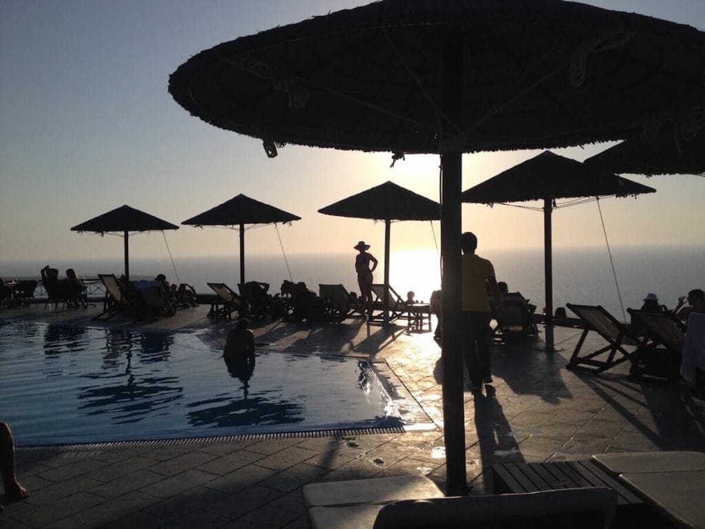 lounge chairs, umbrellas, and a swimming pool at Lioyerma Lounge Cafe Pool Bar, Santorini