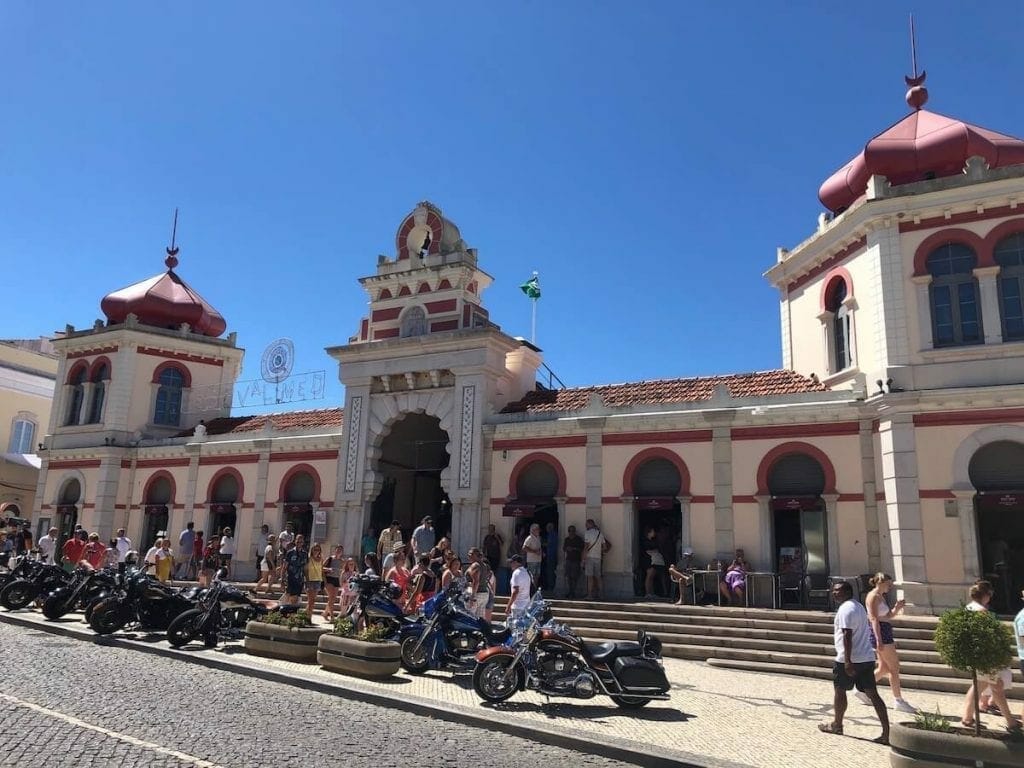 The Arabic inspired facade of Loulé Market and some motorbikes parked in front of it