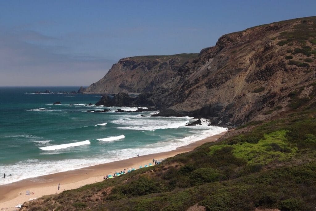 the dramatic landscape of the Vicentine Coast, with massive black cliffs