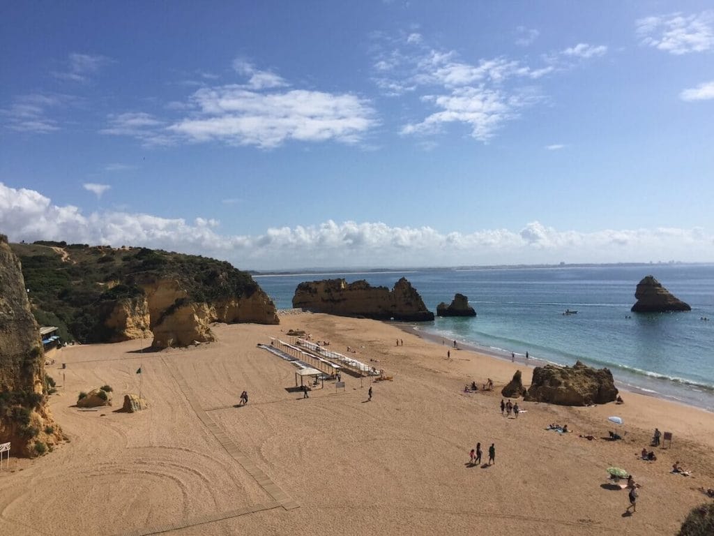 Praia da Dona Ana after the extension with a large beach backed up by yellow cliffs