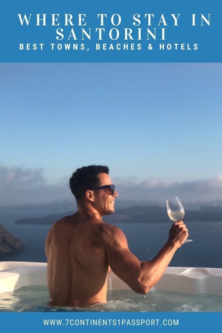 a man wearing sunglasses holding white wine glass in a jacuzzi of a hotel in Imerovigli, Santorini