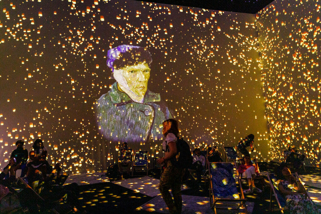 A picture of Vincent Van Gogh projected on a wall during the Van Gogh Immersive experience in London
