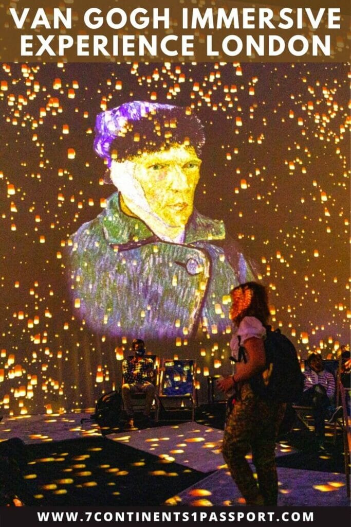 A picture of Vincent Van Gogh projected on a wall during the Van Gogh Immersive experience in London and o woman with a backpack in the middle of the room