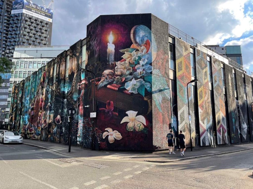 Colt Technology’s London Head Quarter building on New Inn Yard and King John Court covered with a huge street art mural