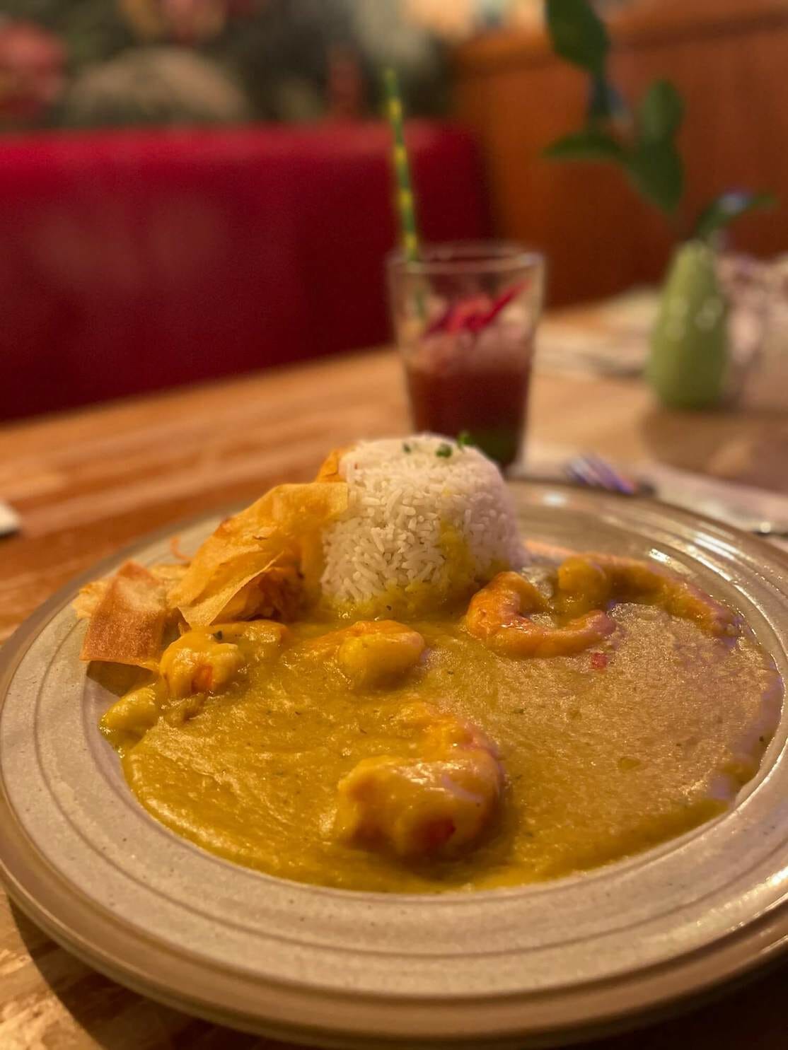 Bobó de camarão (shrimp stew with palm oil, coconut milk and cassava) with rice and chips served at Made in Brasil Restaurant, Camden, London
