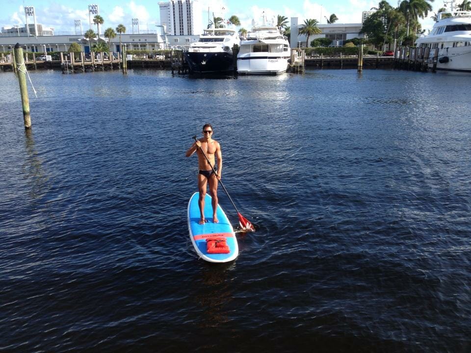 A man paddle boarding on Fort Lauderdale canals