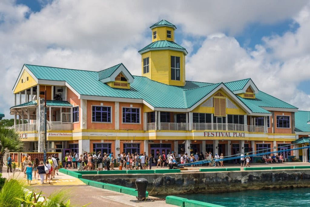 People walking around the colourful Prince George Wharf/Festival Place, Nassau, Bahamas