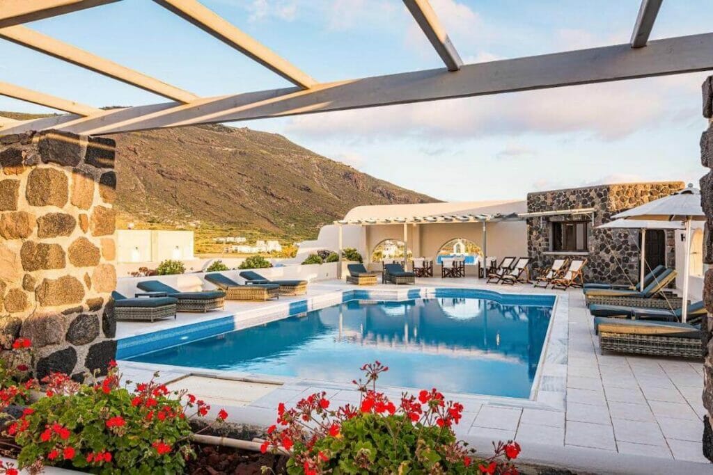 Agia Irini swimming pool with a mountain in the background, Imerovigli, Santorini
