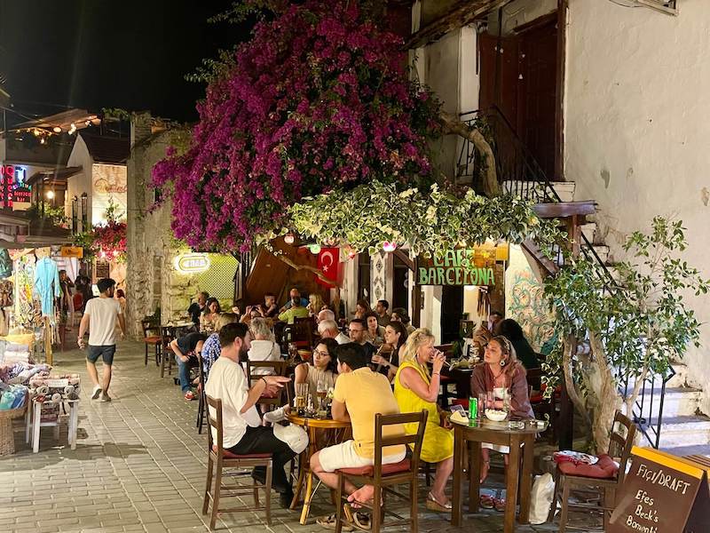 Some people sitting on outside tables at Cafe Barcelona, Kas Old Town, Turkey