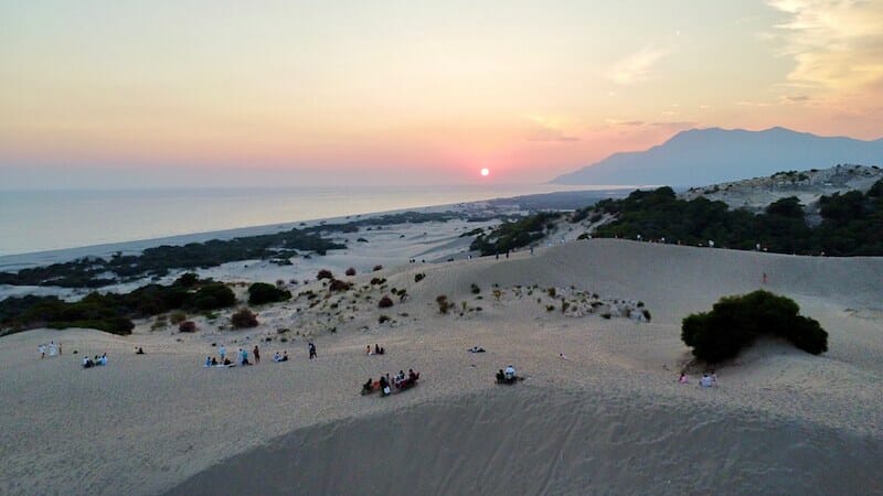 People watching the sunset from Patara Beach sand dune, Turkey