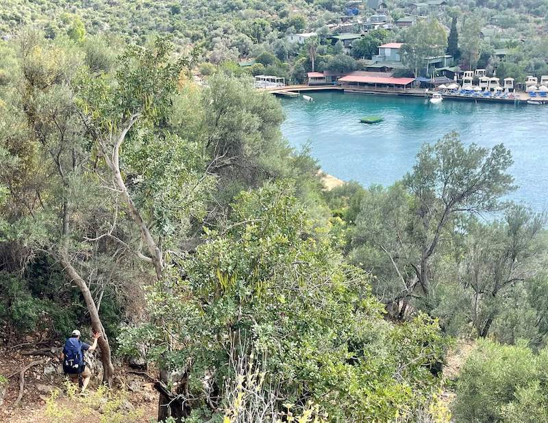 A man carrying a backpack waking the Lycian Way, Kas, Turkey