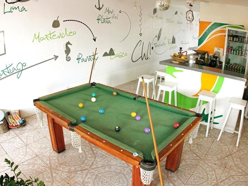 The shared lounge with a pool table of Che Lagarto Hostel, Itacare, Bahia, Brazil