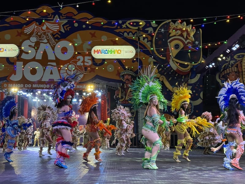 Brazilian carnival dancers in colorful costumes performing on stage at São João festival Maranhão