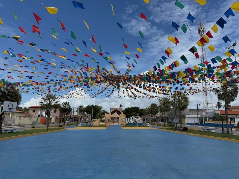 Colorful festival flags in Santo Amaro do Maranhão town square near Lençóis Maranhenses Brazil
