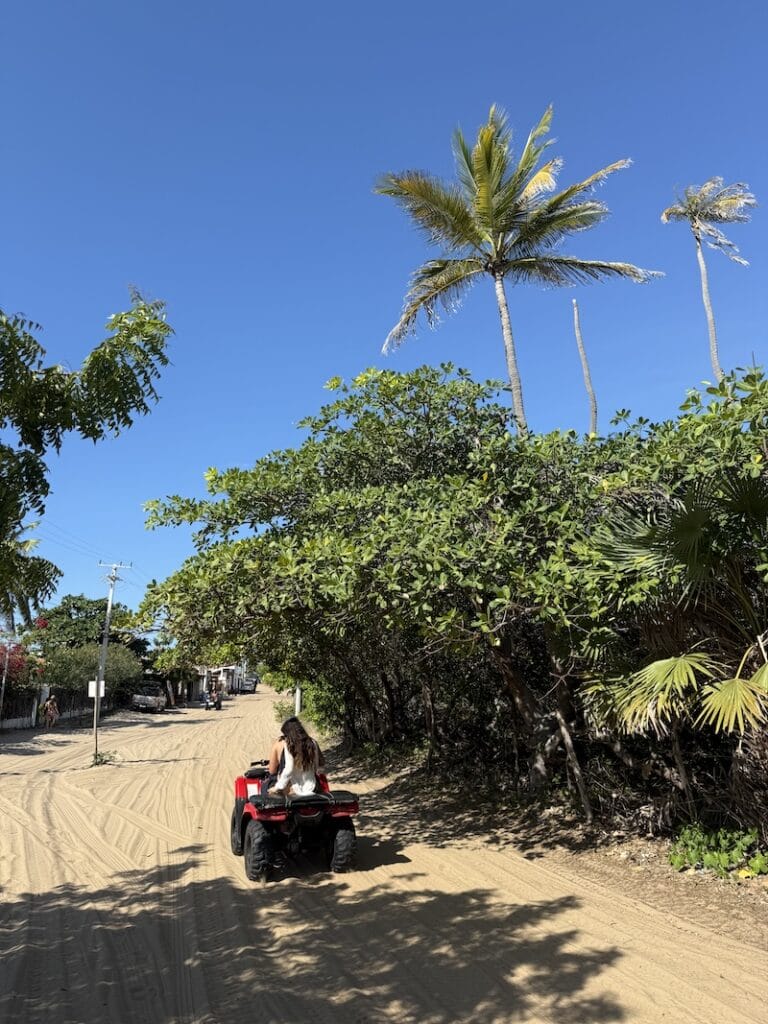 ATV riding on sandy street in Atins Maranhão near Lençóis Maranhenses Brazil